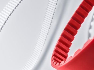 Belts for power transmission overview: red and white timing belts