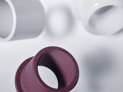 Plastic bushings overview: grey, transparent and burgundy bushings made from different materials